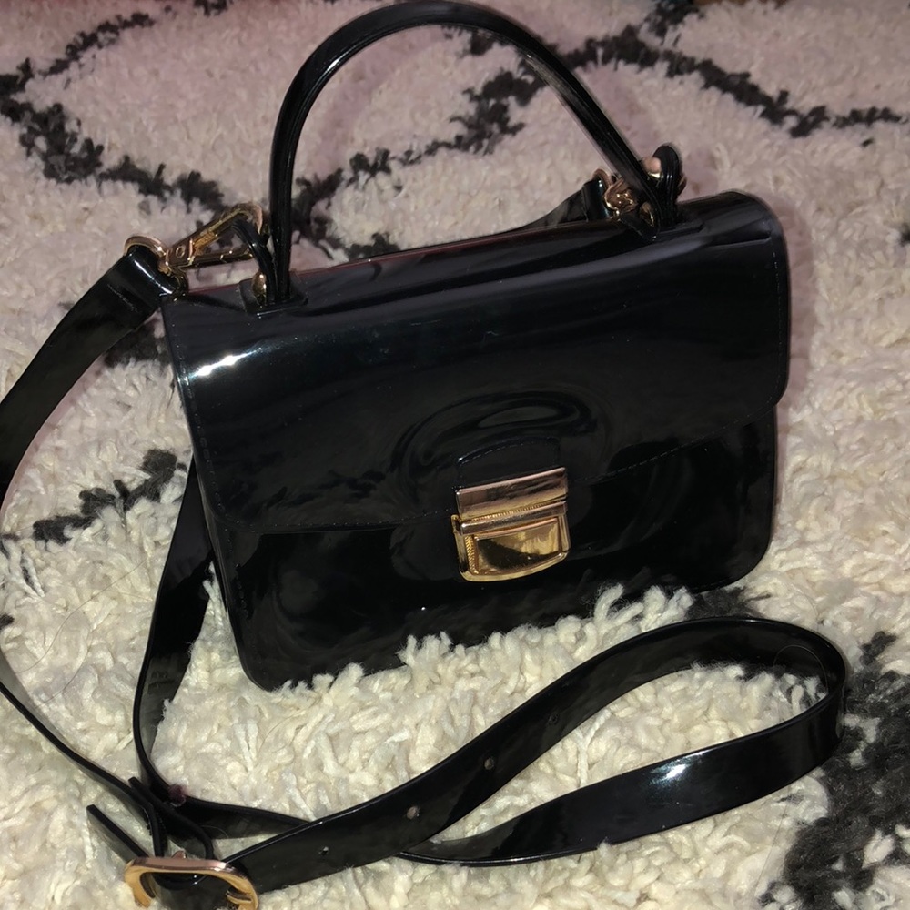 Small black rubber crossbody purse